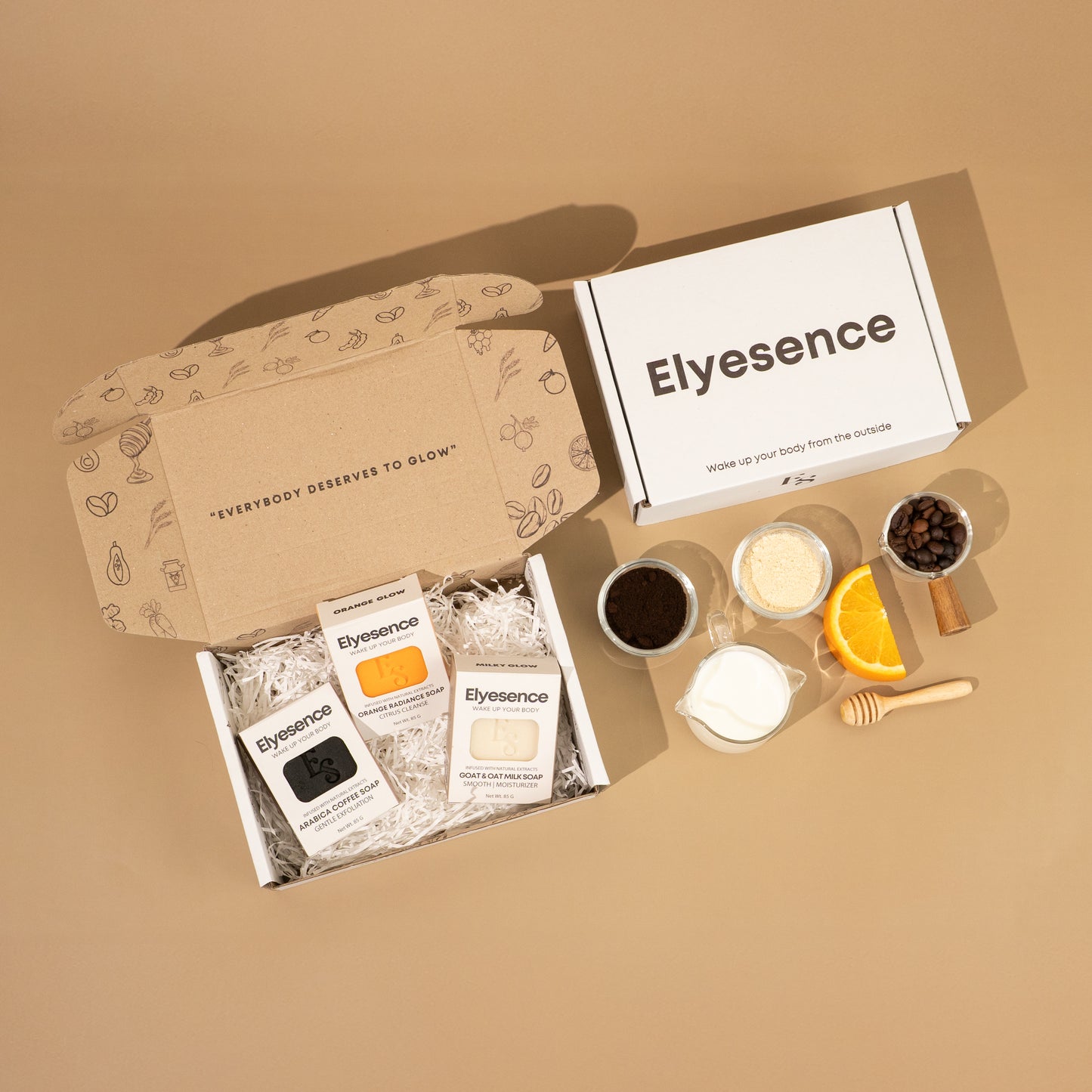 Elyesence Explorer Set containing coffee, orange, and milk soaps with natural ingredients flat laid