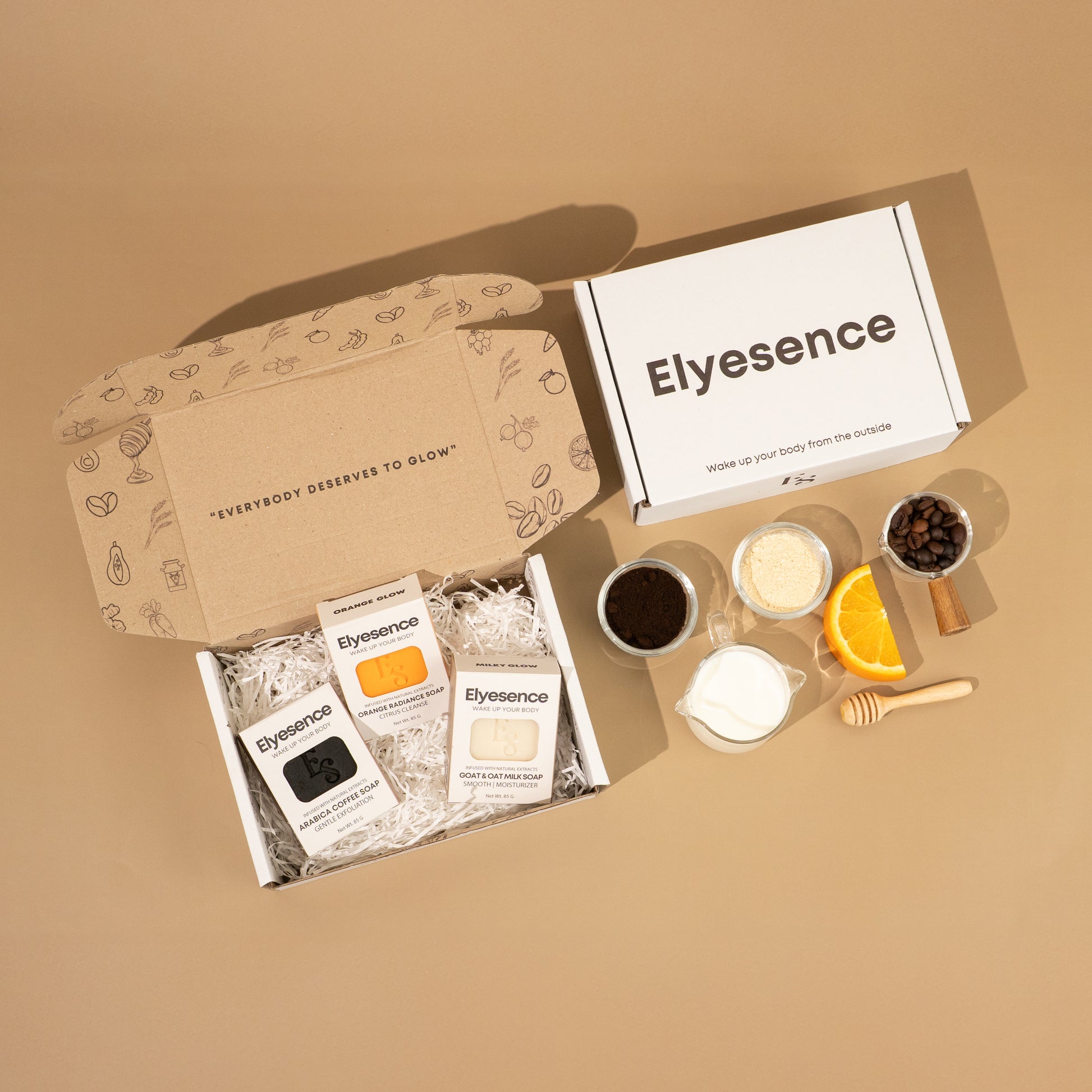 Elyesence Explorer Set containing coffee, orange, and milk soaps with natural ingredients flat laid