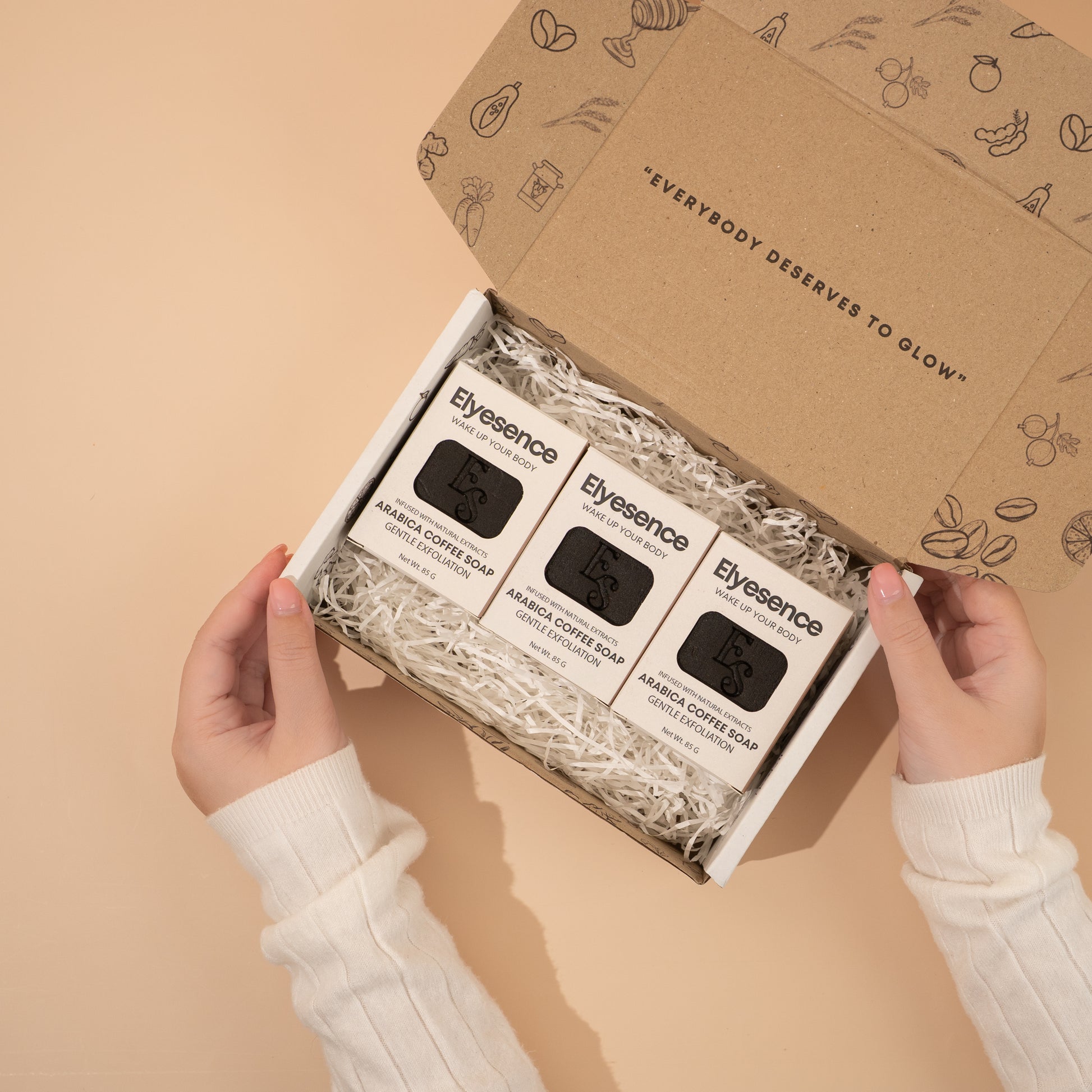 Elyesence Coffee Glow gift box opened to reveal three Arabica Coffee Soap bars, nestled in eco-friendly packaging.